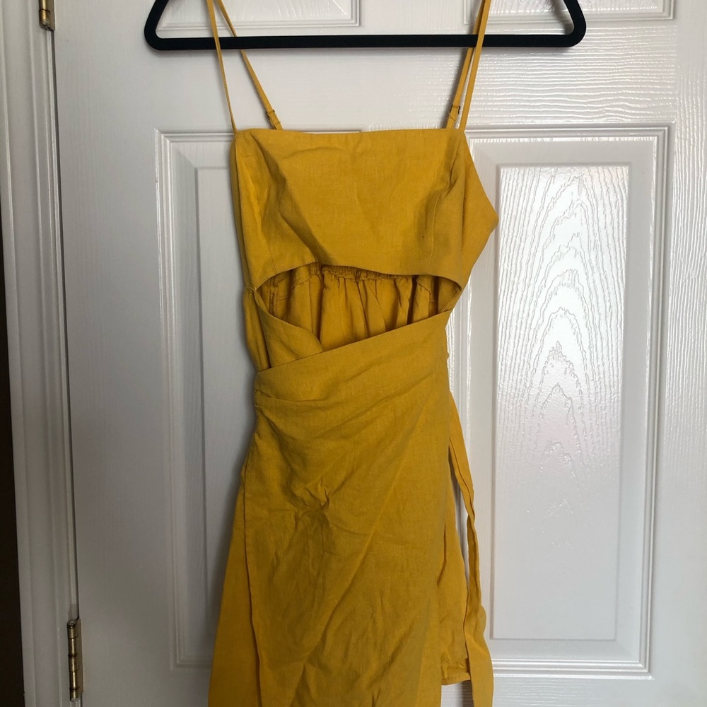 Yellow wrap sundress with small slit under boobs